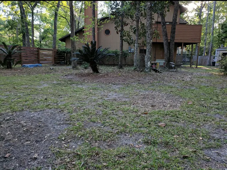 large fenced in back yard is perfect for kids and pets to play in
