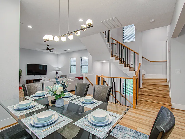 The dining area is thoughtfully equipped with everything you need to enjoy meals and relax with family after a busy day.