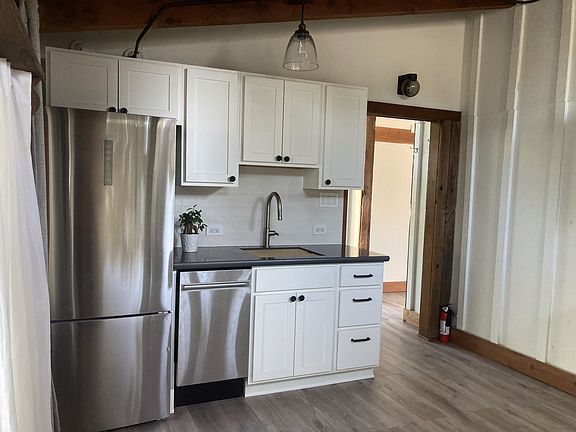 renovated kitchen with entry from foyer