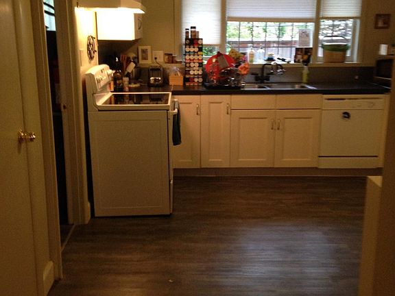 On left side of living room is opening to kitchen
