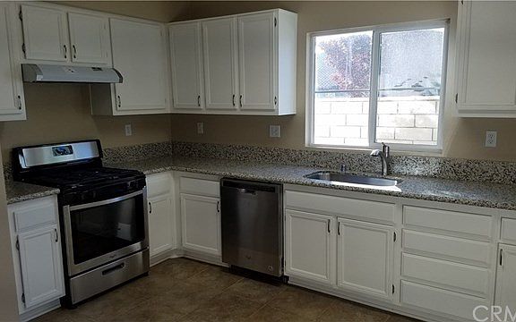 JUST RESURFACED CABINETS WITH NEW HARDWARE AND HANDLES. NEW GRANITE COUNTER TOPS, STAINLESS STEEL SI