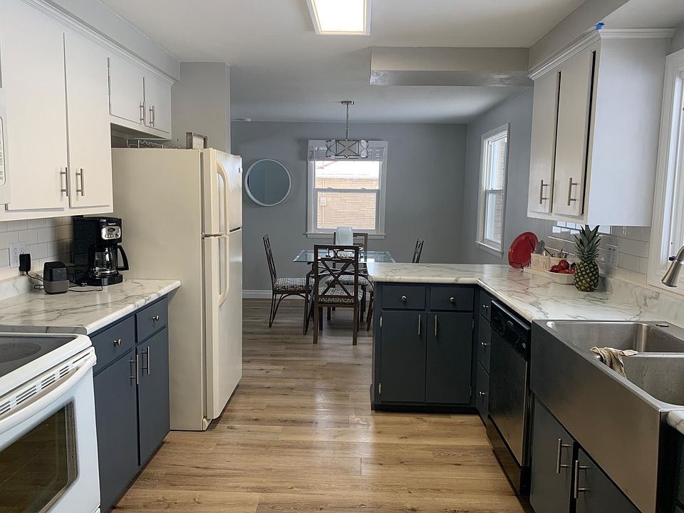 Kitchen with farm-house stainless steel sink