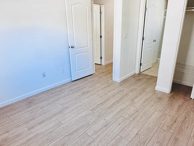 Full guest bedroom with attached full bath - ideal for guests, family members, or a home office.