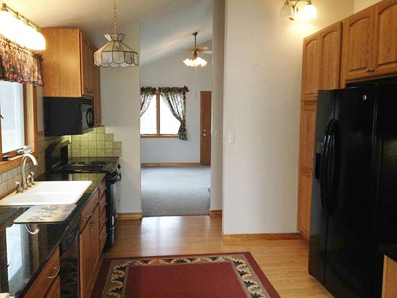 The kitchen has been upgraded with JennAir range, GE refrigerator, Thomasville cabinets and granite countertops.  This room opens up into the Great room.