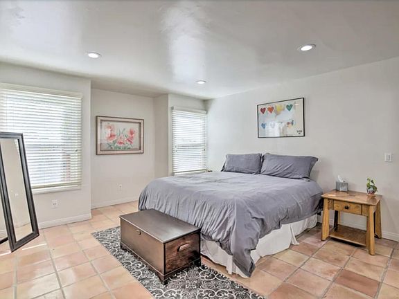 spacious bedroom with 2 windows