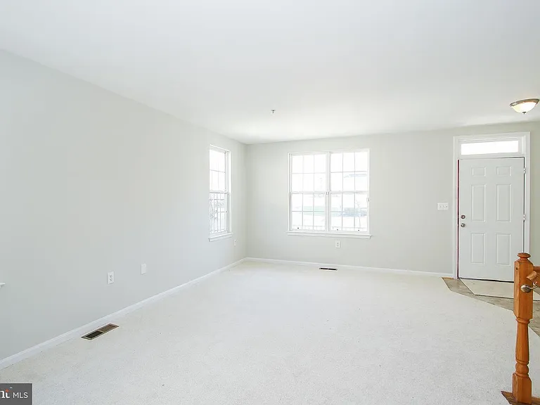 Living room space from Kitchen entrance.