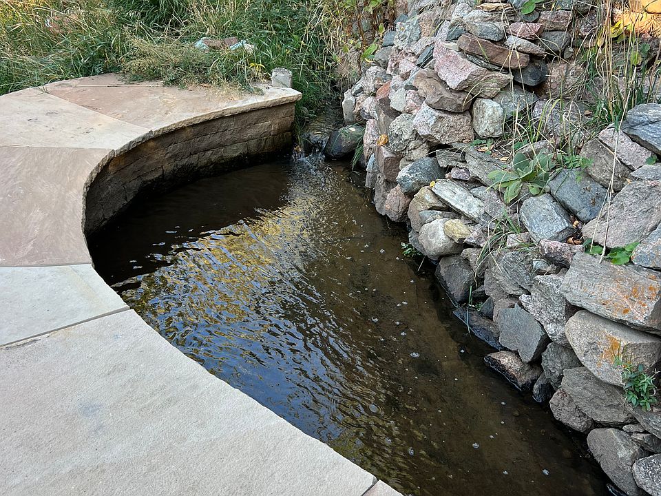 Acequia - natural water coming from the lake in the wilderness flowing through the property