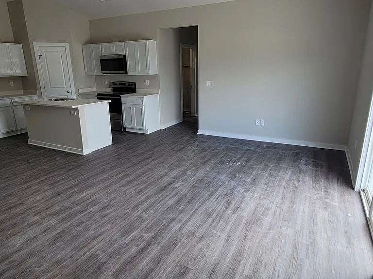 Large open concept living room, kitchen, and dining