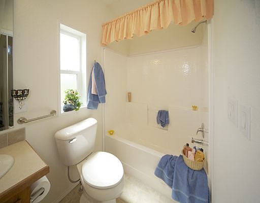 Guest bath w/ tub combo, med. cabinet, ADA Hi toilet