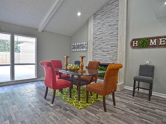 Soaring Ceilings, floor-to-ceiling windows, modern fireplace!