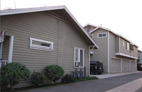 Garages and side view of 207 Lawrene