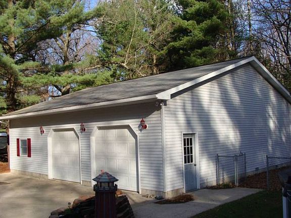 The pole barn garage is 16 x 24 and 12x 40 cold storage. The 4 car garage space is 40'wide by 28' deep.The garage space is heated and insulated.