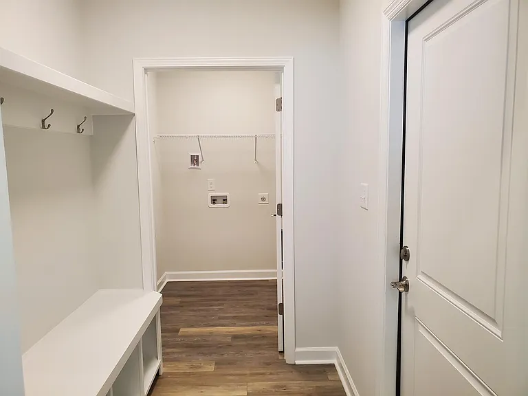 Mudroom off garage with laundry room