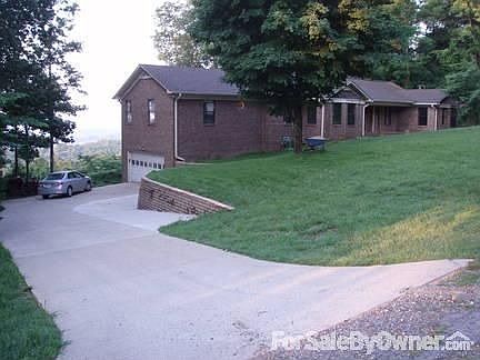 Stairway going up through retaining wall on to front lawn