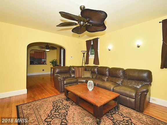 Spacious living room with gleaming hardwood floors