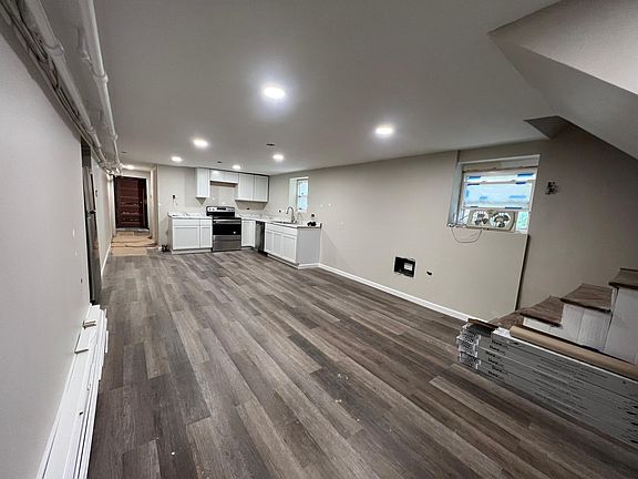 Living area kitchen. The entryway stairs are on the right.