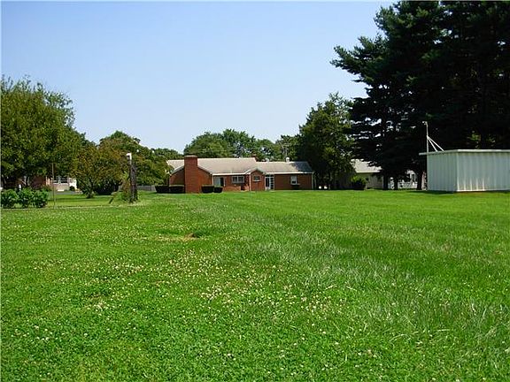 Large solid outbuilding to the right