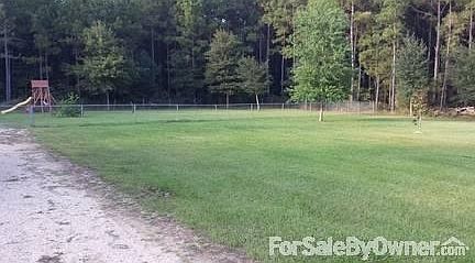 Fenced in Back yard (1/2 acre roughly fenced in)