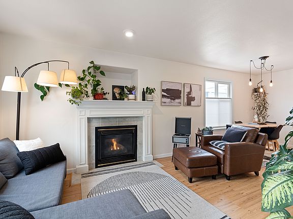 the cozy living room is made for relaxing evenings curled up by the fire.