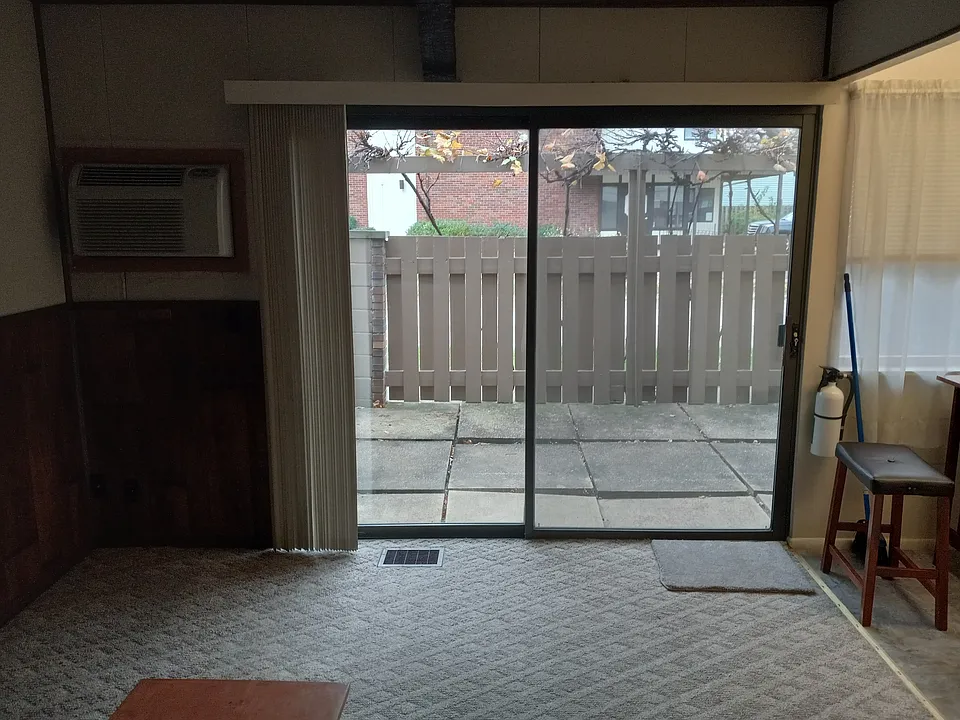 Large Living room with sliding door to Large fenced Patio