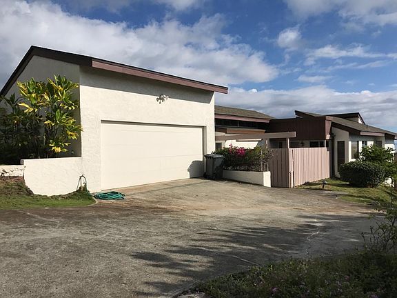 Front of the house with a garage and spacious parking