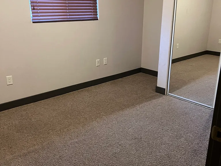 Bedroom #2 with mirrored closet fronts
