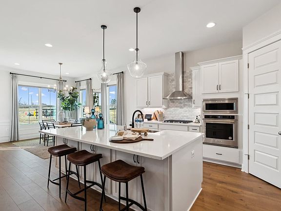 The kitchen in the Matisse model single family home at Hiatt Pointe at Snowden Bridge by Brookfield