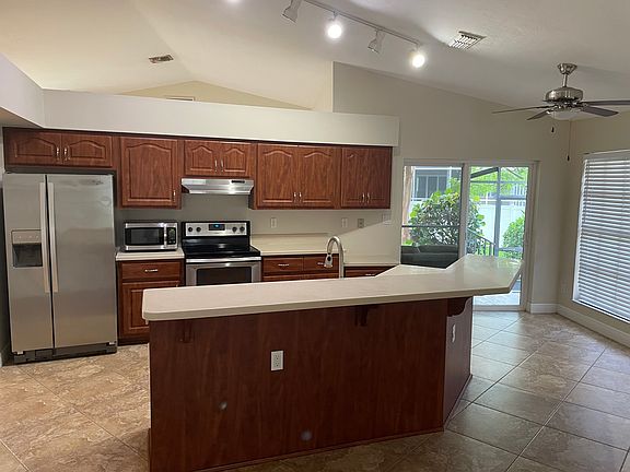 Kitchen with breakfast area at end of great room.