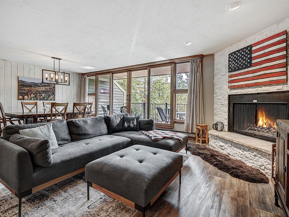 Open floor plan. Living room and dining room with Pella sliding glass doors to large deck.