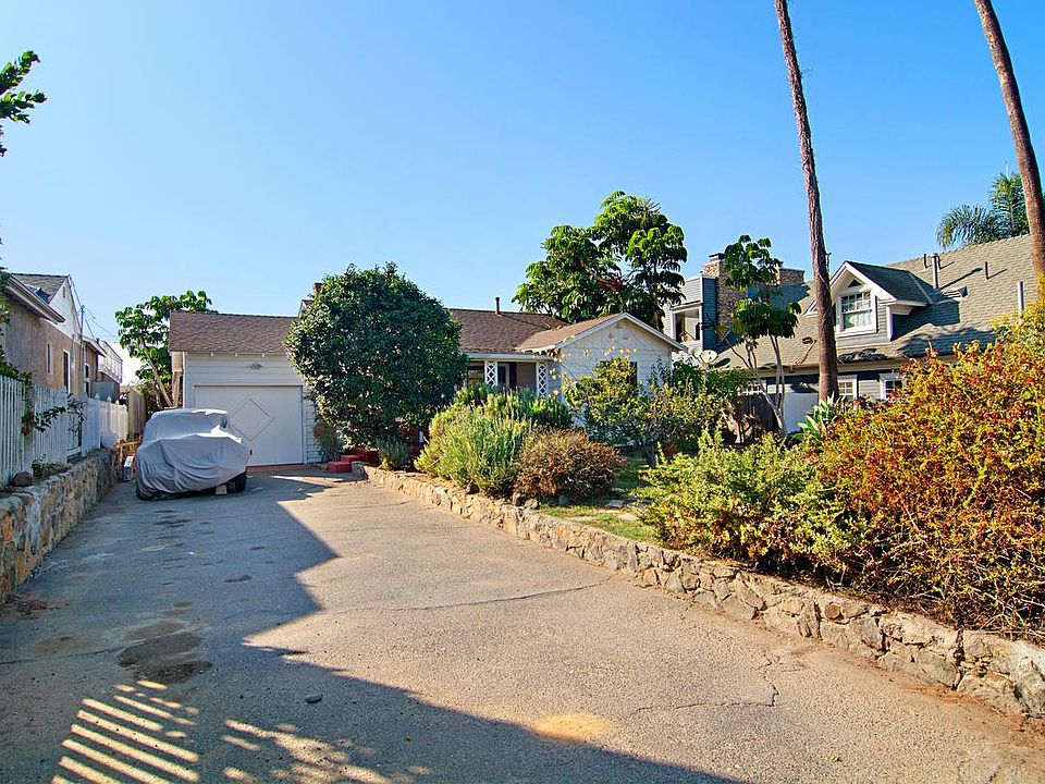 Front of home, front yard, and private driveway leading to g