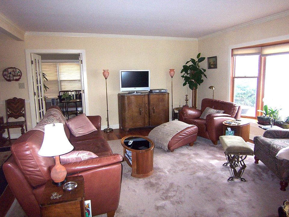 Living Room -- Large Bay Window With Beautiful Lake View -- Stone Fireplace-- 