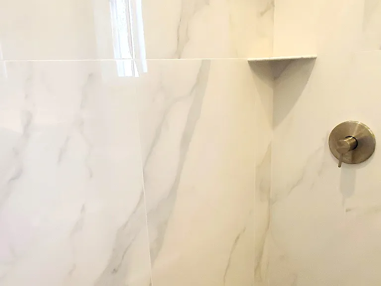 Nicely remodeled shower with new faucets
