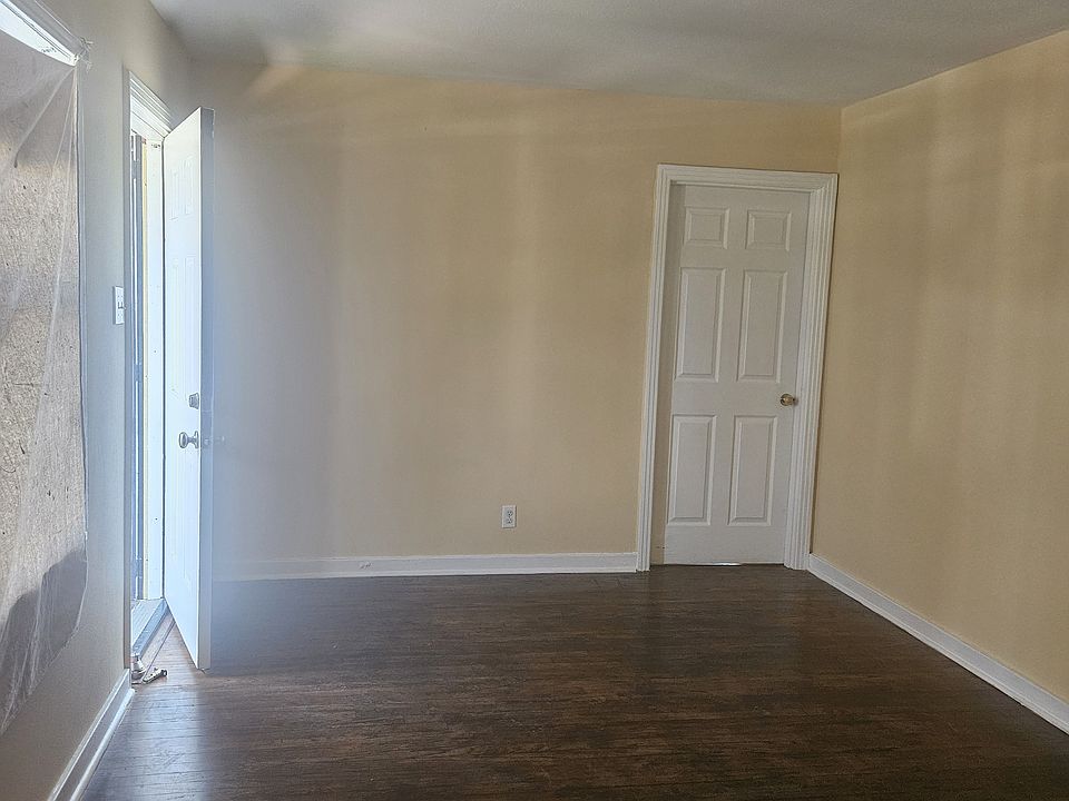 Living Room: Facing Front Door and Hall Entry to Bedroom's 1 and 2