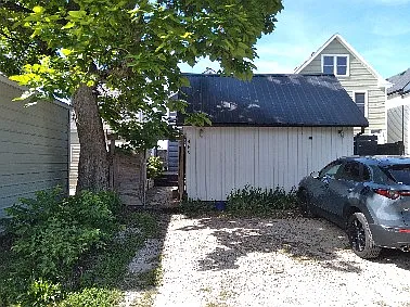 Parking area behind the house.
