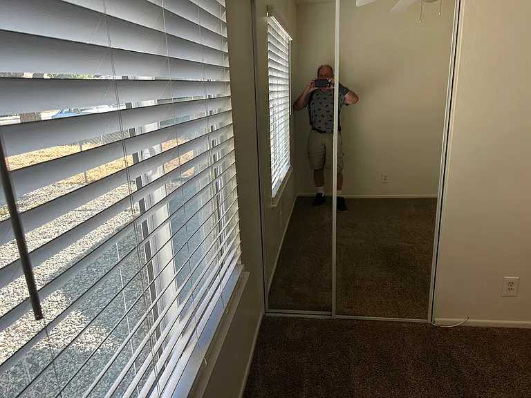 9'X10' SE BEDROOM WITH 2" CUSTOM BLINDS AND MIRRORED DOORS