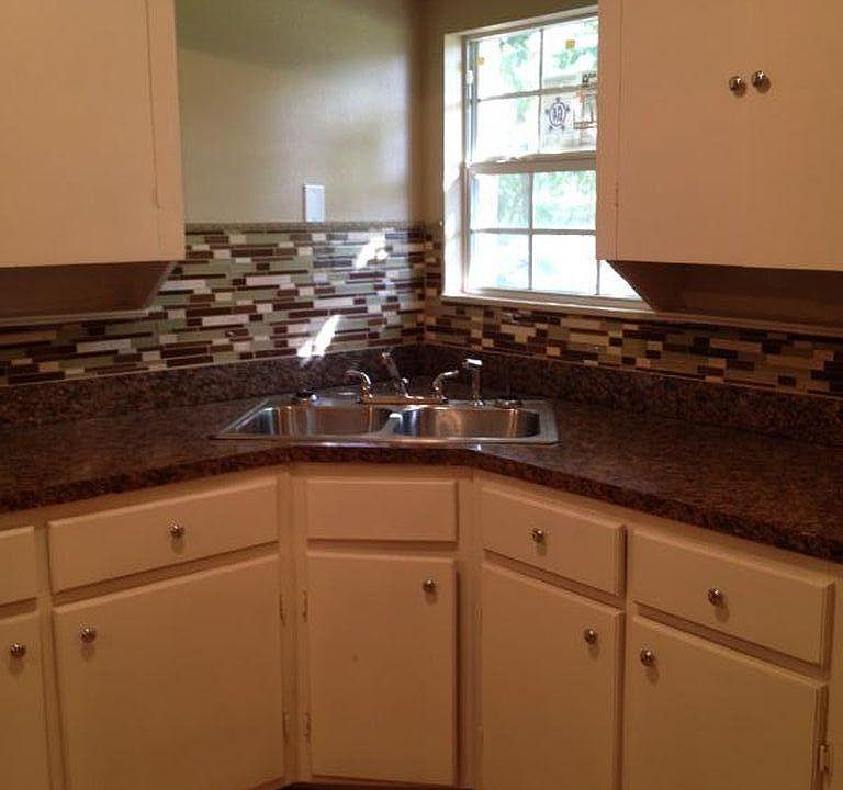 Large Kitchen with Glass Backsplash