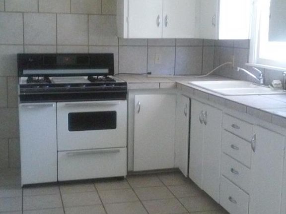 CLEAN kitchen with gas range included