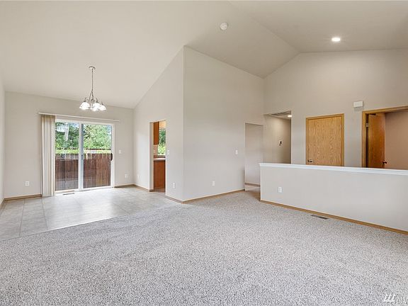 High ceilings add to the spacious feel of the entry foyer, living room and dining room. This large connected space is ideal for entertaining and everyday living. 