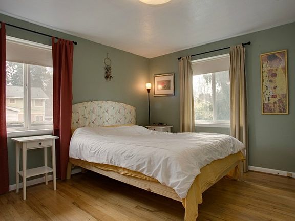 Good sized Master Bedroom with wood floors & 2 large windows.