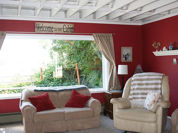 Light floods in the living room ghrough this large picture window.