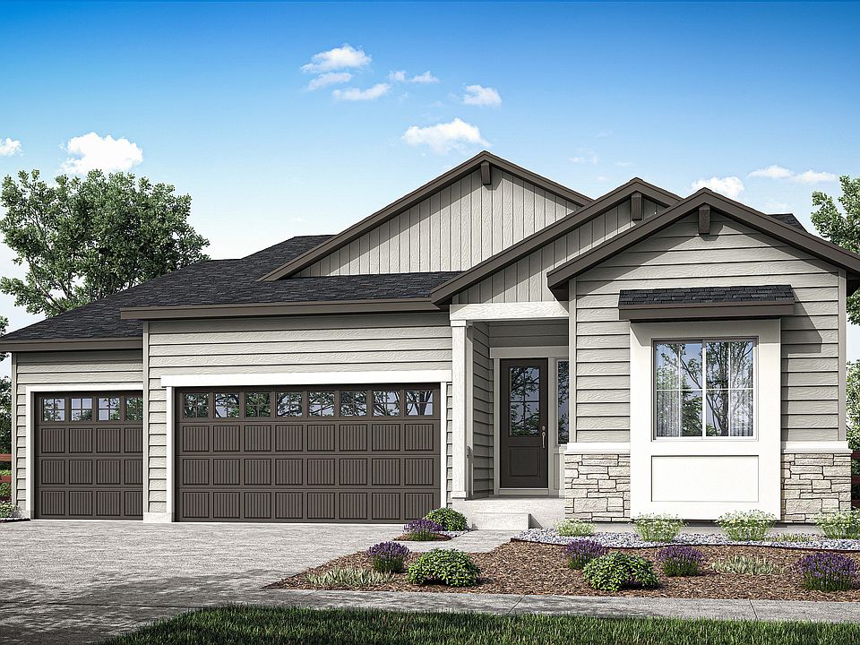 A single-story residential house with a garage, surrounded by landscaped gardens and trees against a