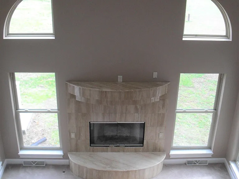 Looking down into family room from second floor hallway. Note the gas log fireplace.