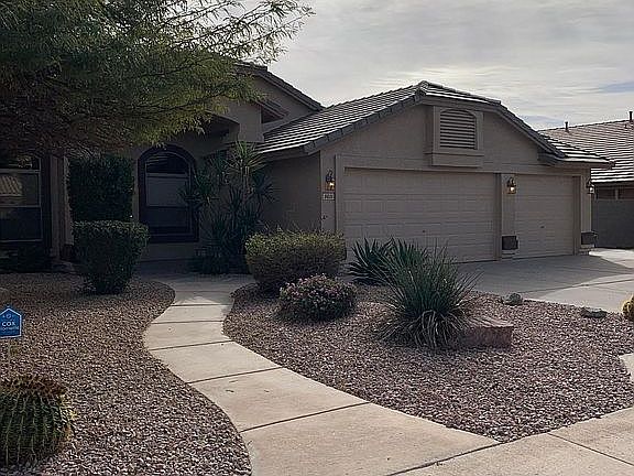 Front of house with three car garage