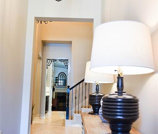 Gorgeous hardwood floors, pendant lights, 10 ft. ceilings greet you as you come through the front door and to the left you have a full bath and 2 secondary bedrooms.