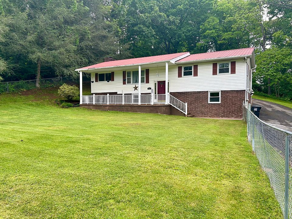 Front of home with fenced in yard.