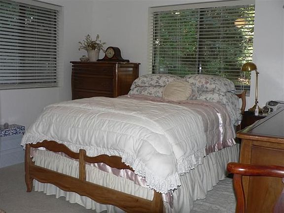 Large bedrooms with lots of windows looking out to private treed property