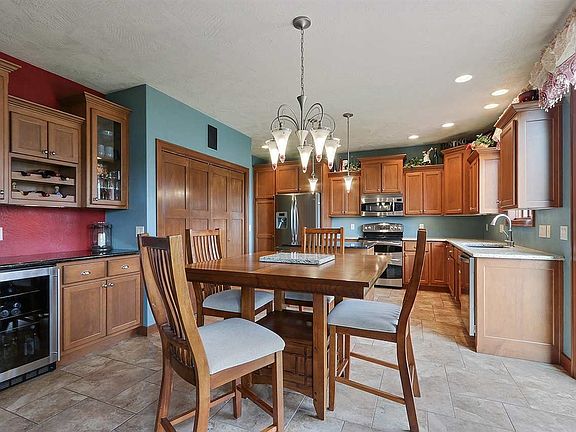 The sun drenched kitchen/dining area is perfect for entertaining. Look at that coffee/wine bar!
