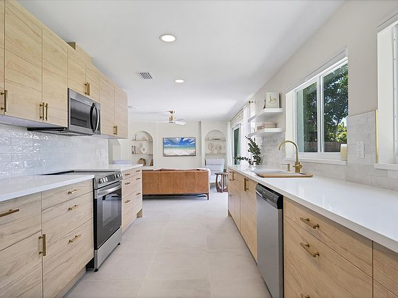 Large new kitchen with pass-through windows for outdoor dining & grilling