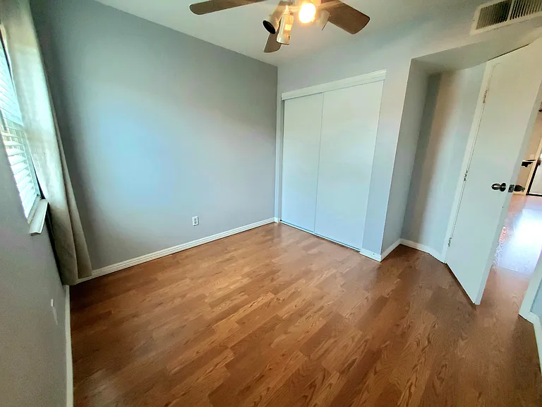 3rd bedroom with dual-pane solar-tinted windows