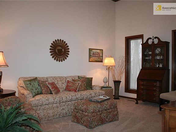 Your formal living room offers a vaulted ceiiling